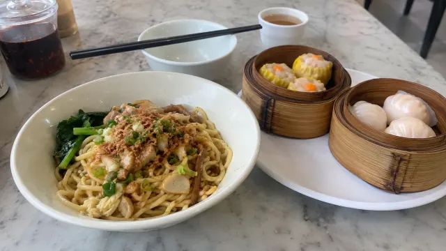 Illustration: noodles and dim sum on a marble kopitiam table
