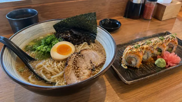 Illustration: ramen and sushi on a wooden counter