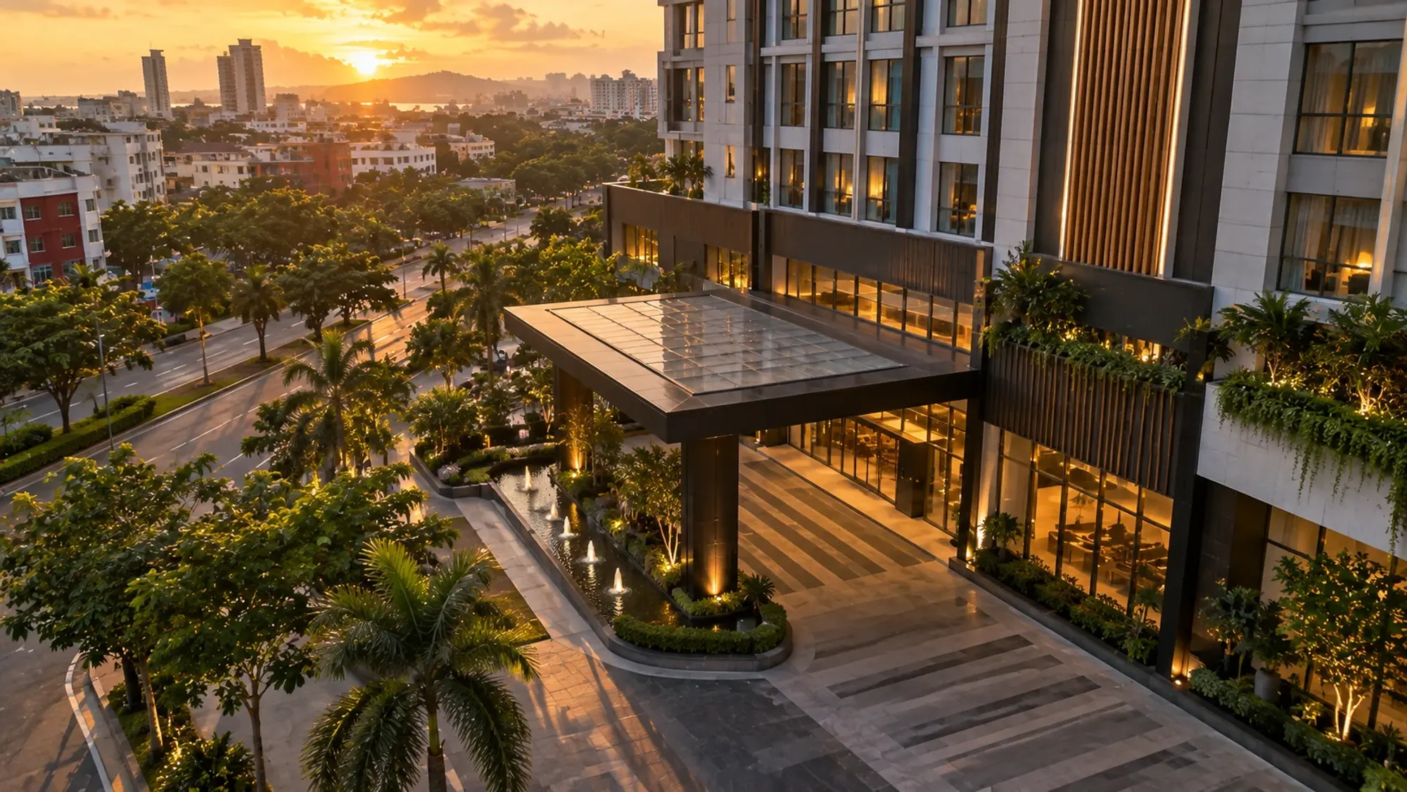 The building exterior and entrance at golden hour of a 4-star city hotel — Harmoni Suites, a 4-star city hotel in Nagoya, Batam