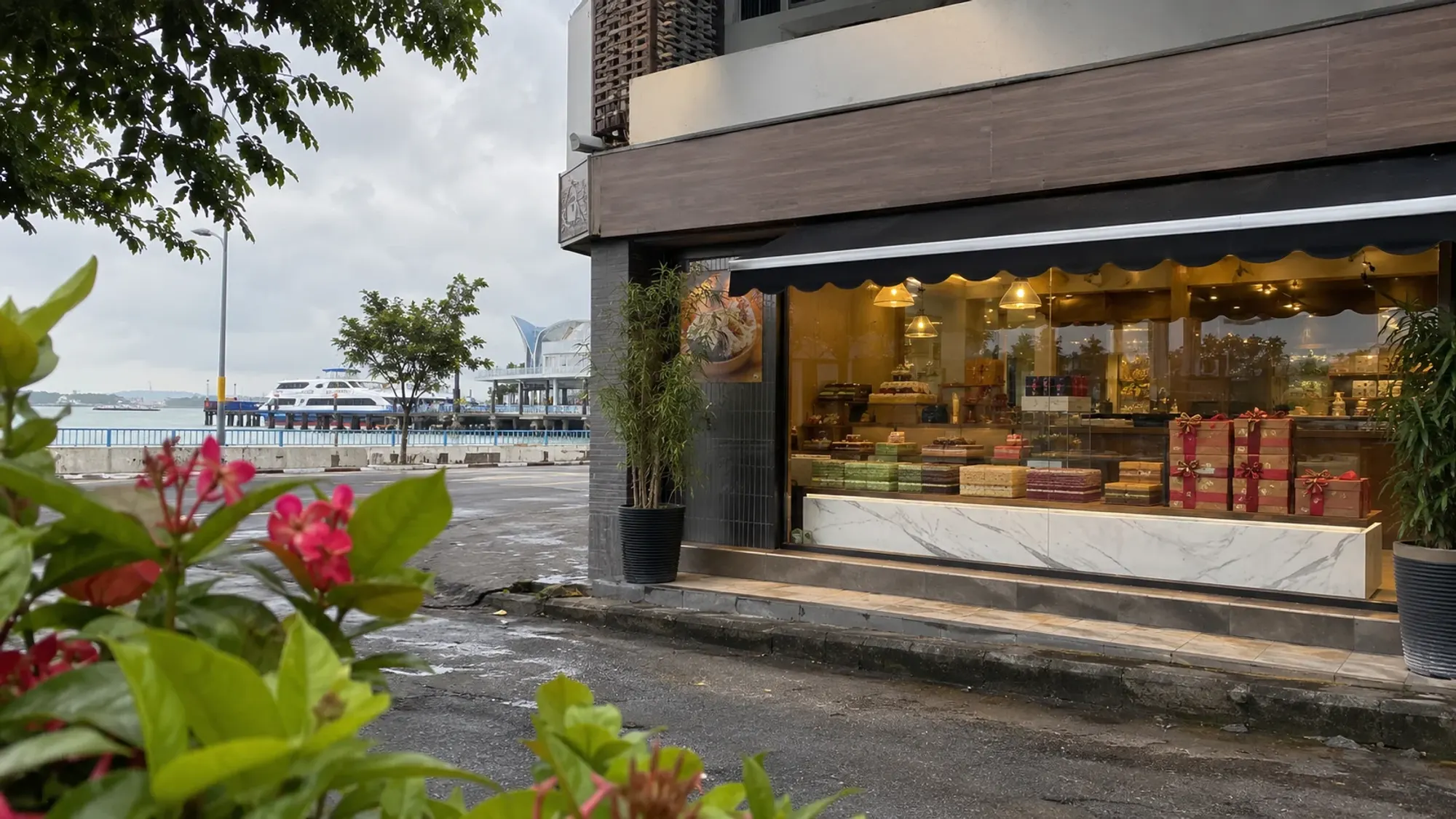 Kueh lapis slices next to gift boxes — Lapisa Harbour Bay, a bakery in Harbour Bay, Batam