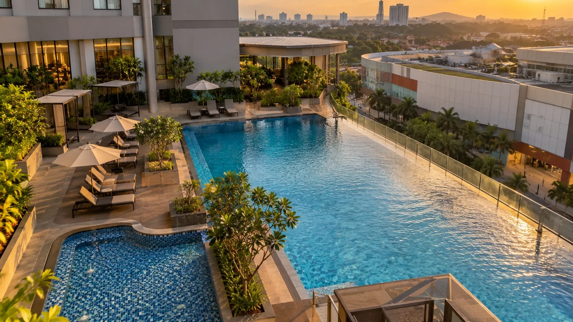 The swimming pool area in late afternoon of a 4-star city hotel — Oakwood Hotel & Apartments Grand Batam, a 4-star city hotel in Nagoya, Batam