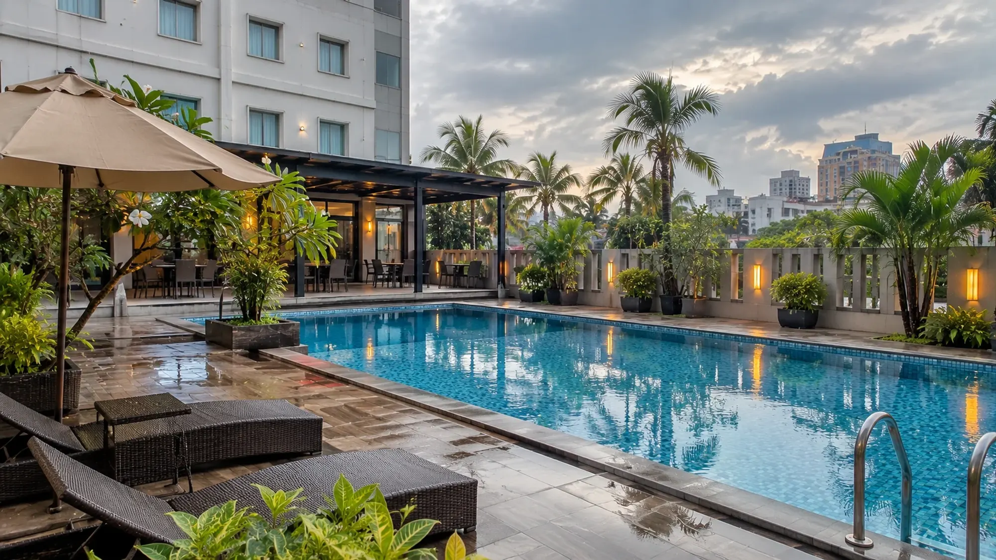 The swimming pool area in late afternoon of a 1-star budget hotel — Redlink Hotel, a 1-star budget hotel in Batam Centre, Batam