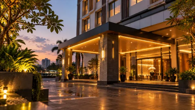 The building exterior and entrance at golden hour of a 3-star city hotel — Swiss-Belinn Baloi Batam, a 3-star city hotel in Nagoya, Batam